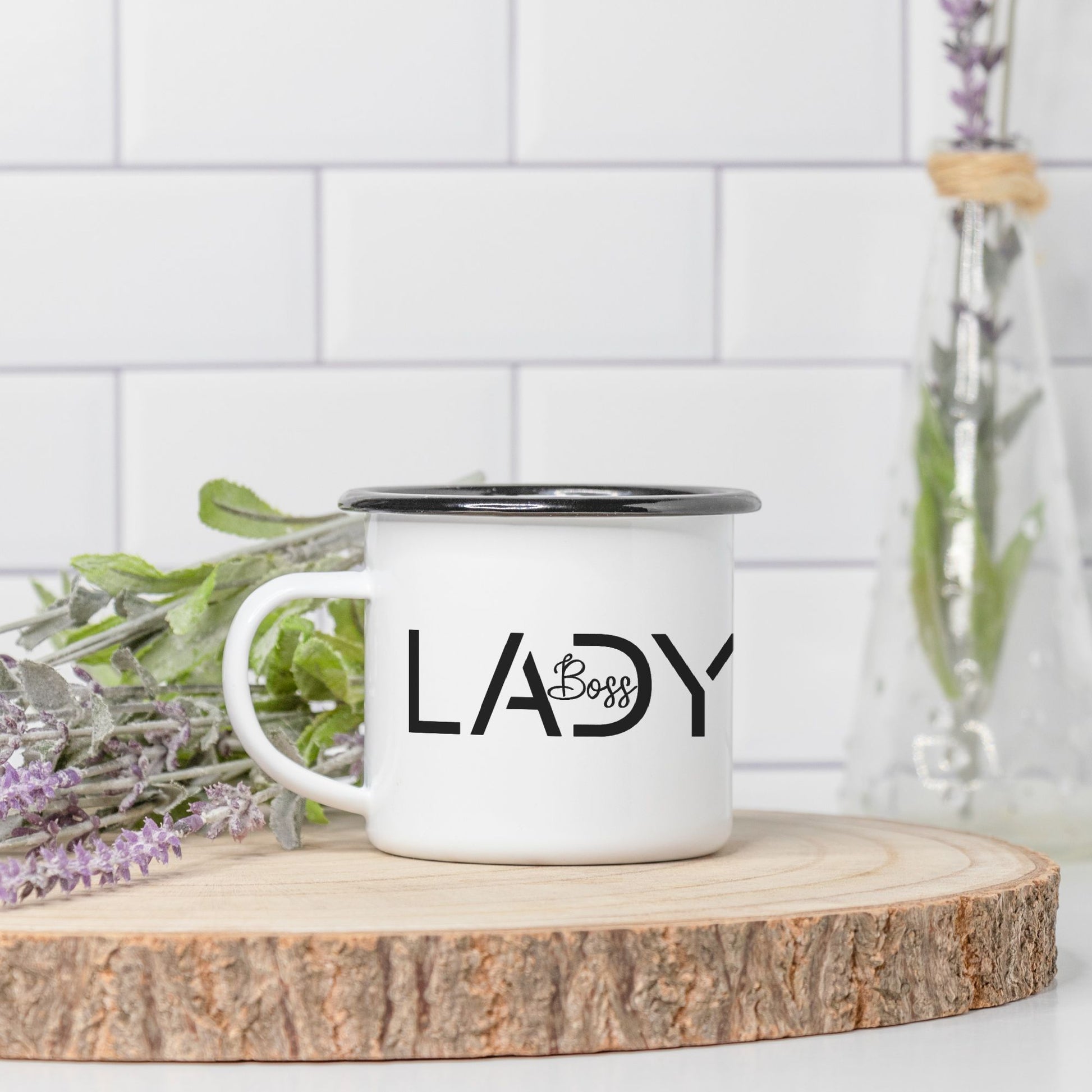 Elevate your mornings with our Camp Mug 10 oz. (Black Rim) - Boss Lady Modern from Designs On The Go. Empower your day with this stylish and durable mug, perfect for coffee or tea enthusiasts on the move.