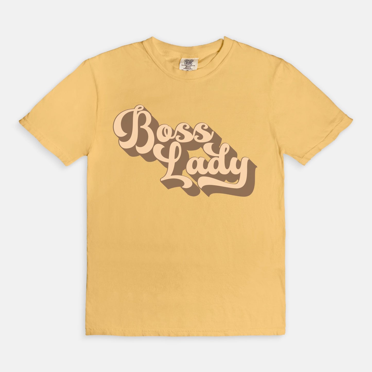 Embrace vintage vibes with the Comfort Color Tee 1717 - Boss Lady Retro from Designs On The Go. This comfy, durable tee boasts a chic, nostalgic design perfect for making a statement. Whether you’re at work or out with friends, this tee combines style and comfort seamlessly.