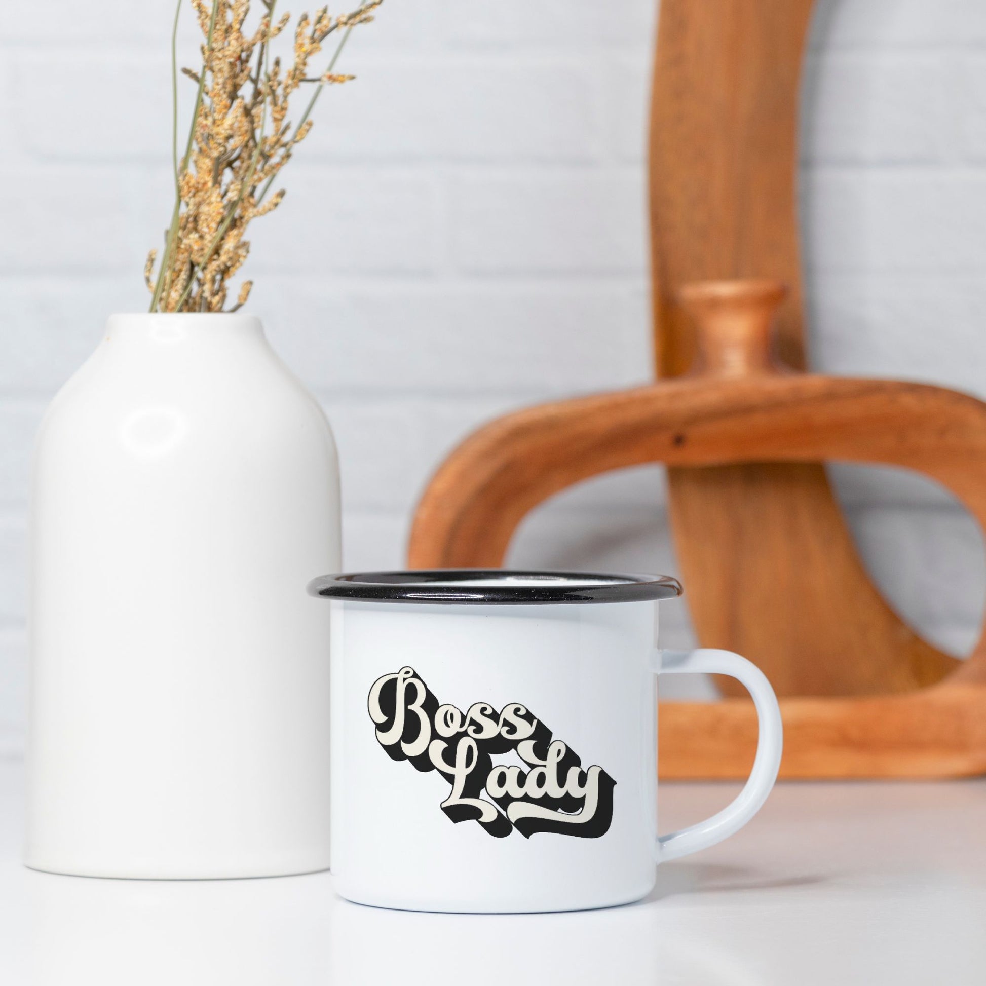 Revive nostalgia with our Camp Mug 10 oz. (Black Rim) - Boss Lady Retro from Designs On The Go. Infuse your mornings with vintage charm using this durable and stylish mug, ideal for coffee or tea aficionados on the move.