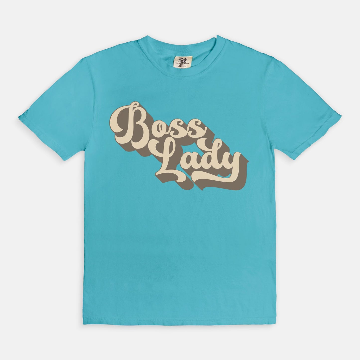 Embrace vintage vibes with the Comfort Color Tee 1717 - Boss Lady Retro from Designs On The Go. This comfy, durable tee boasts a chic, nostalgic design perfect for making a statement. Whether you’re at work or out with friends, this tee combines style and comfort seamlessly.