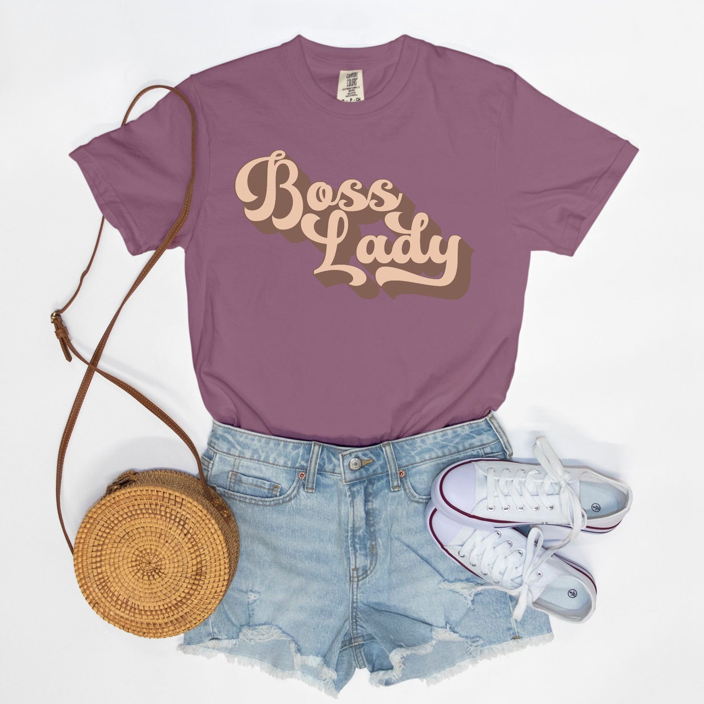 Embrace vintage vibes with the Comfort Color Tee 1717 - Boss Lady Retro from Designs On The Go. This comfy, durable tee boasts a chic, nostalgic design perfect for making a statement. Whether you’re at work or out with friends, this tee combines style and comfort seamlessly.