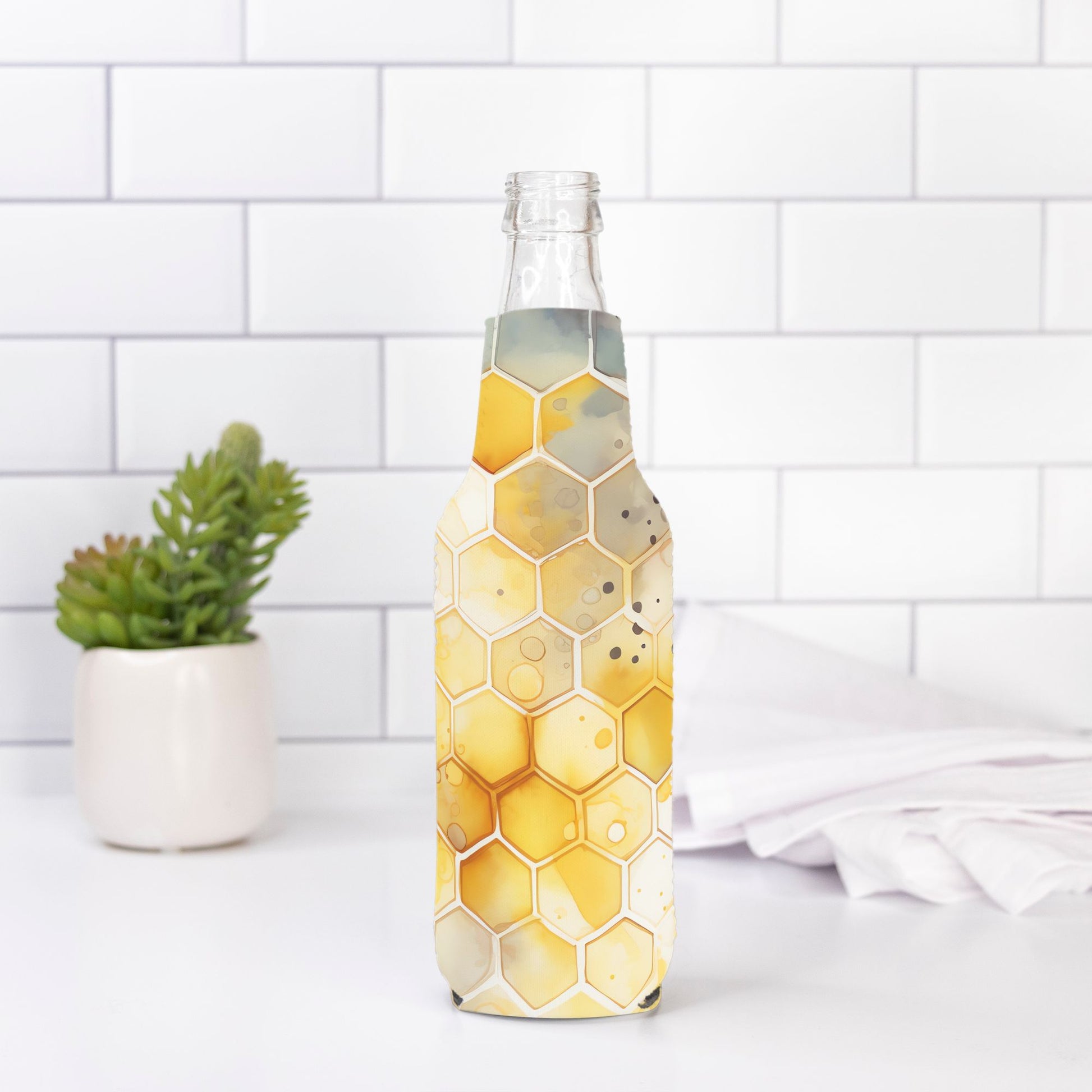 Add a buzz to your bottle with our Bottle Wrap - Beehive Splash from Designs On The Go. Featuring a vibrant beehive pattern, this durable and stylish wrap is perfect for showcasing your unique style. Transform your hydration routine with this eye-catching accessory.