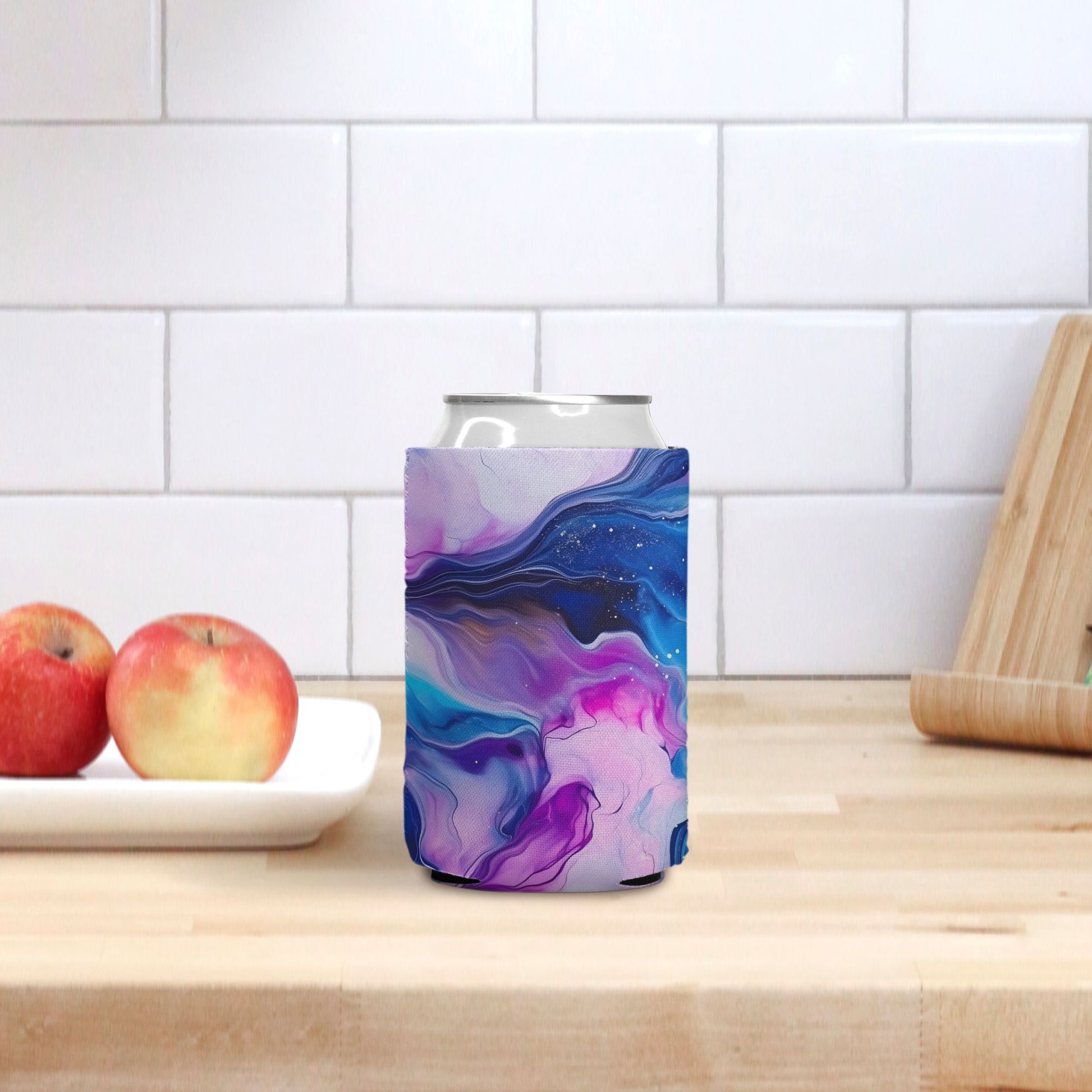 Transform your refreshment experience with our Jewel Tone Marble Can Cooler from Designs On The Go. This unique cooler blends vibrant jewel tones with the elegance of marble, ensuring your drinks stay chilled and stylish. Perfect for any occasion, it's an essential accessory for those who appreciate both functionality and eye-catching design in their beverage gear.