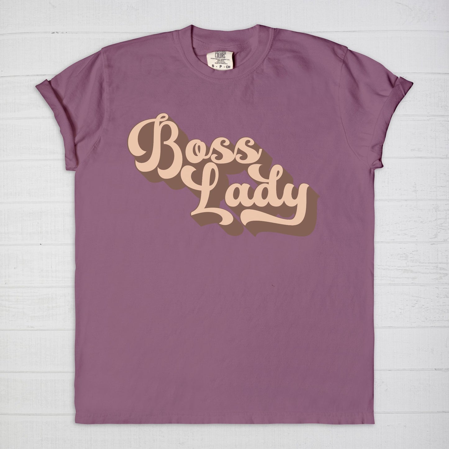 Embrace vintage vibes with the Comfort Color Tee 1717 - Boss Lady Retro from Designs On The Go. This comfy, durable tee boasts a chic, nostalgic design perfect for making a statement. Whether you’re at work or out with friends, this tee combines style and comfort seamlessly.