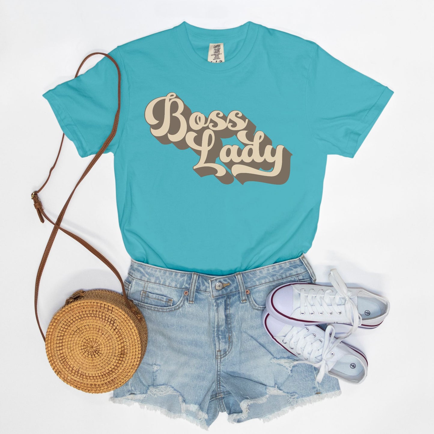 Embrace vintage vibes with the Comfort Color Tee 1717 - Boss Lady Retro from Designs On The Go. This comfy, durable tee boasts a chic, nostalgic design perfect for making a statement. Whether you’re at work or out with friends, this tee combines style and comfort seamlessly.