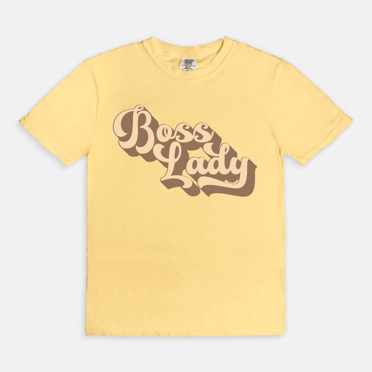 Embrace vintage vibes with the Comfort Color Tee 1717 - Boss Lady Retro from Designs On The Go. This comfy, durable tee boasts a chic, nostalgic design perfect for making a statement. Whether you’re at work or out with friends, this tee combines style and comfort seamlessly.