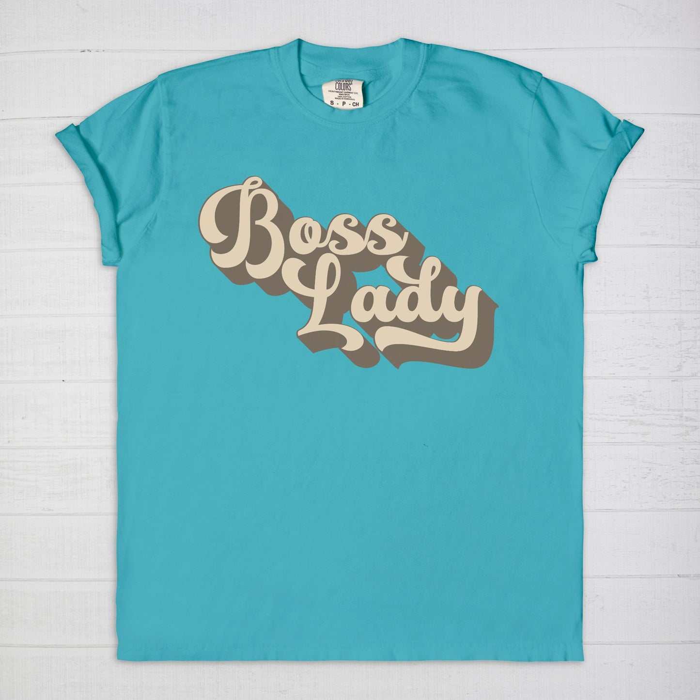 Embrace vintage vibes with the Comfort Color Tee 1717 - Boss Lady Retro from Designs On The Go. This comfy, durable tee boasts a chic, nostalgic design perfect for making a statement. Whether you’re at work or out with friends, this tee combines style and comfort seamlessly.