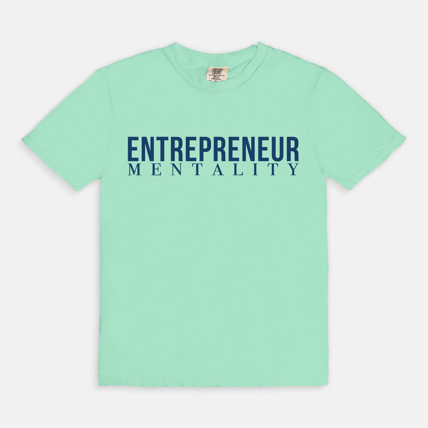 Showcase your drive with the Comfort Color Tee 1717 - Entrepreneur Mentality from Designs On The Go. This comfortable, high-quality tee embodies your ambitious spirit with a sleek design, perfect for daily wear. Elevate your casual wardrobe and inspire success with every step you take.