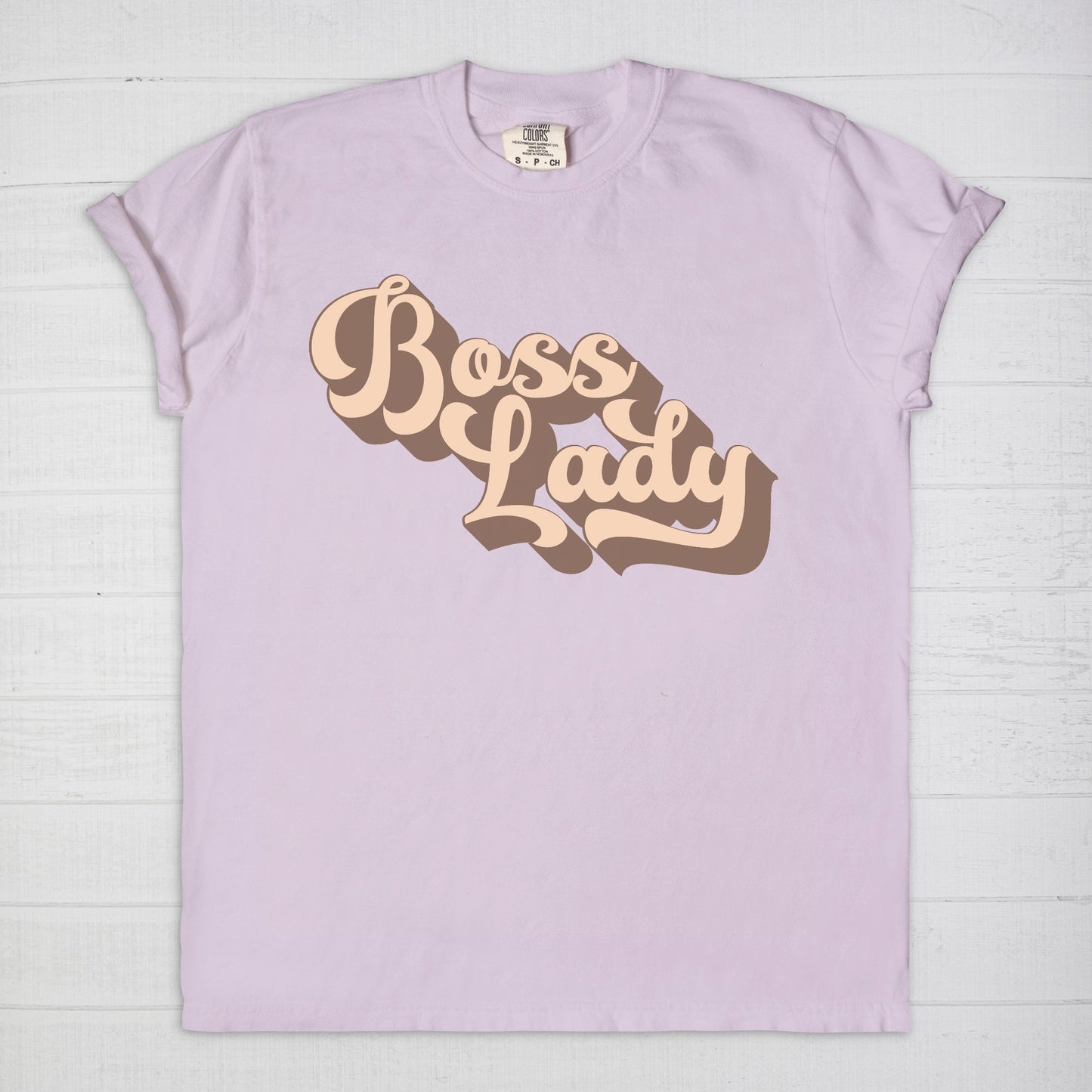 Embrace vintage vibes with the Comfort Color Tee 1717 - Boss Lady Retro from Designs On The Go. This comfy, durable tee boasts a chic, nostalgic design perfect for making a statement. Whether you’re at work or out with friends, this tee combines style and comfort seamlessly.