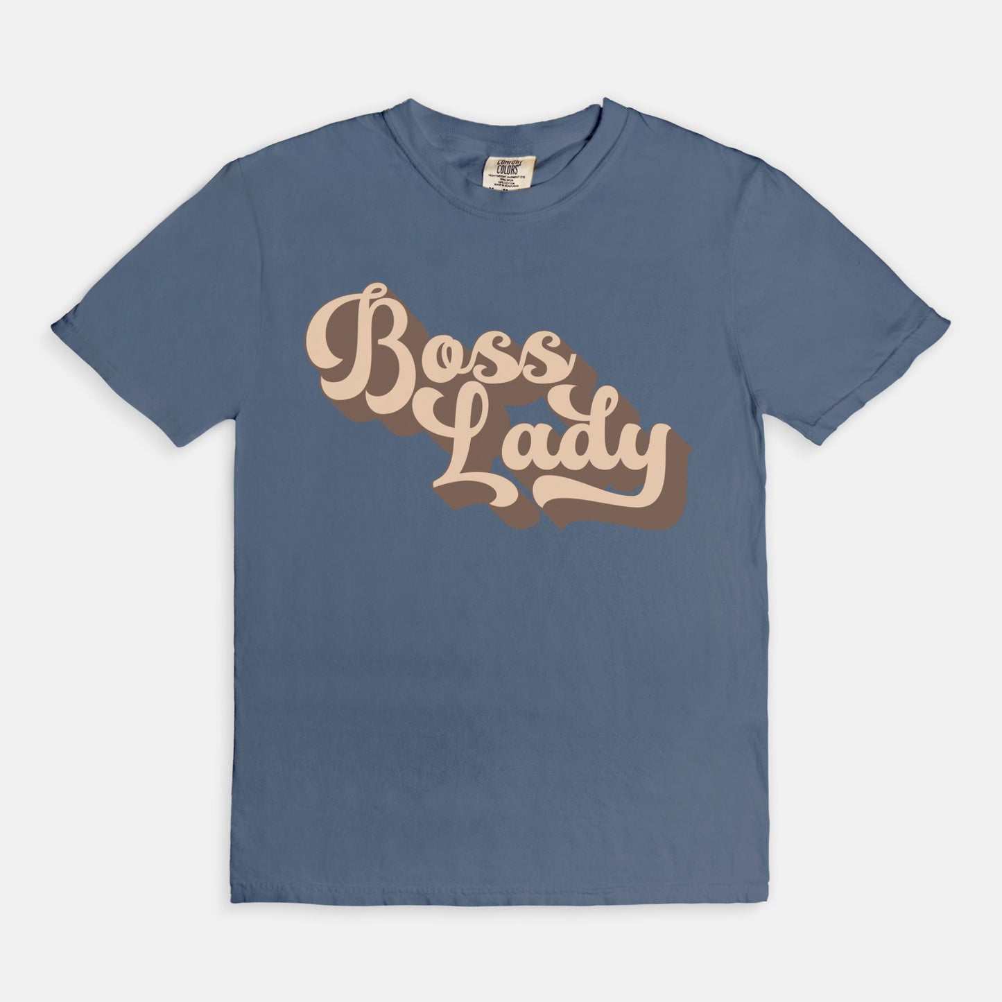 Embrace vintage vibes with the Comfort Color Tee 1717 - Boss Lady Retro from Designs On The Go. This comfy, durable tee boasts a chic, nostalgic design perfect for making a statement. Whether you’re at work or out with friends, this tee combines style and comfort seamlessly.