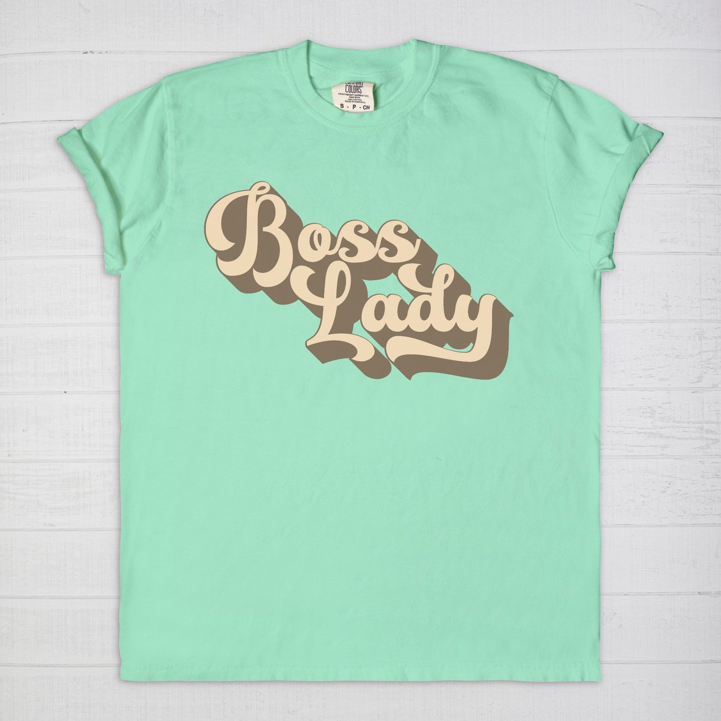 Embrace vintage vibes with the Comfort Color Tee 1717 - Boss Lady Retro from Designs On The Go. This comfy, durable tee boasts a chic, nostalgic design perfect for making a statement. Whether you’re at work or out with friends, this tee combines style and comfort seamlessly.