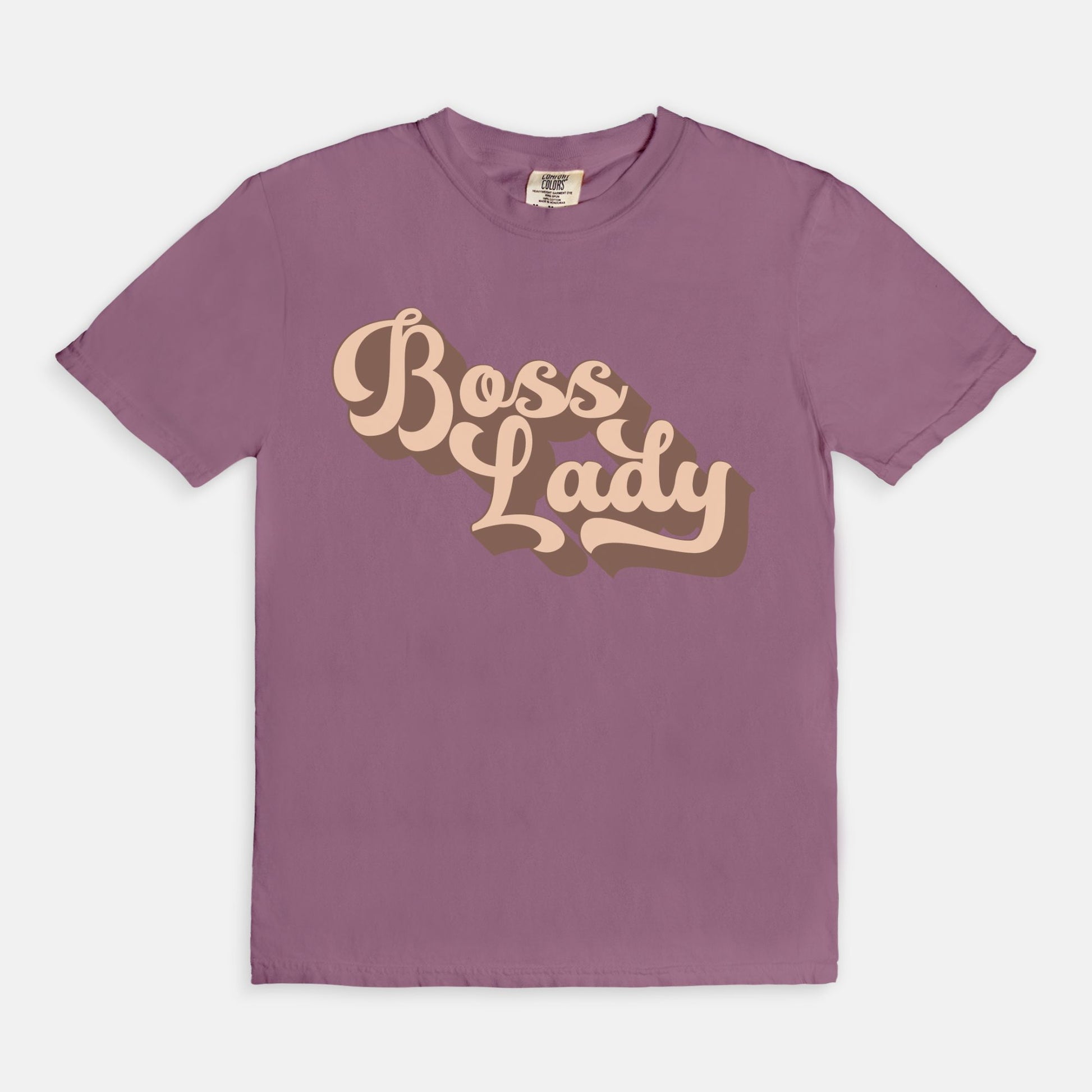 Embrace vintage vibes with the Comfort Color Tee 1717 - Boss Lady Retro from Designs On The Go. This comfy, durable tee boasts a chic, nostalgic design perfect for making a statement. Whether you’re at work or out with friends, this tee combines style and comfort seamlessly.