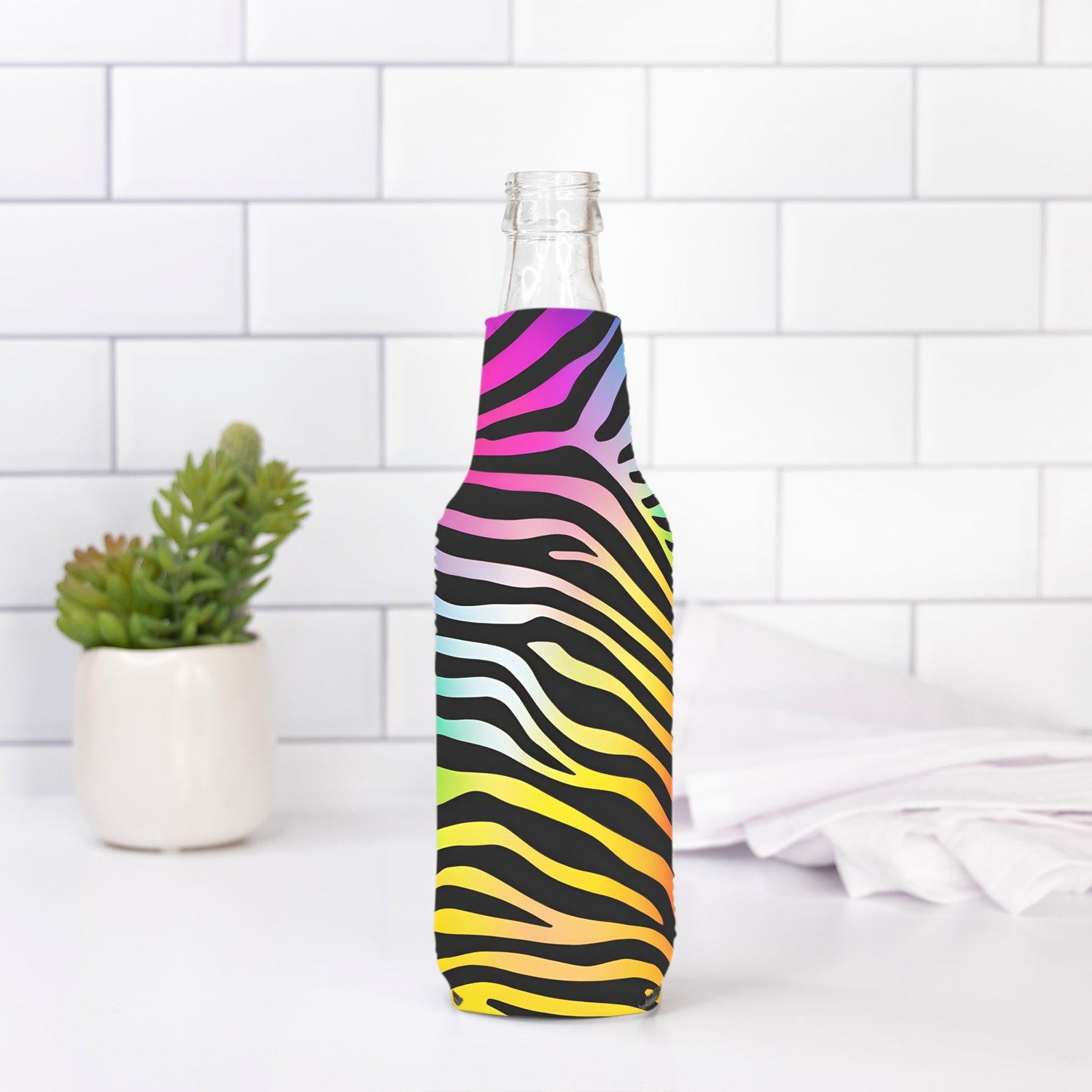 Stand out with our Bottle Wrap - Rainbow Zebra from Designs On The Go. This unique wrap features a bold rainbow zebra pattern, adding a touch of wild style to your bottle. Durable and eye-catching, it's perfect for showcasing your vibrant personality and making your hydration routine more fun.