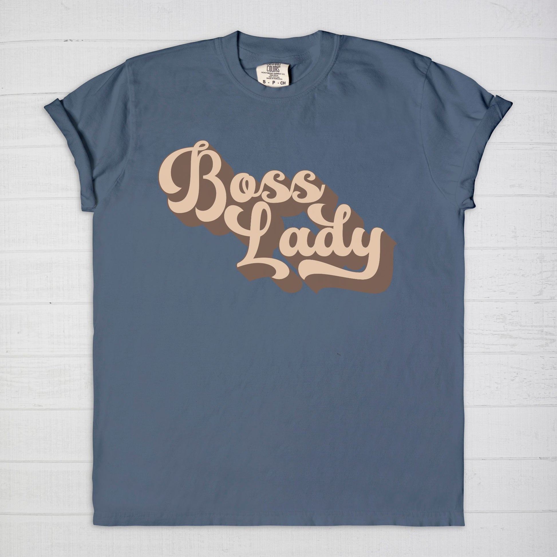 Embrace vintage vibes with the Comfort Color Tee 1717 - Boss Lady Retro from Designs On The Go. This comfy, durable tee boasts a chic, nostalgic design perfect for making a statement. Whether you’re at work or out with friends, this tee combines style and comfort seamlessly.