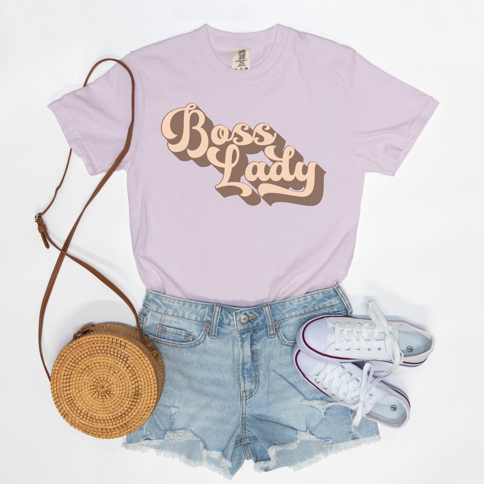 Embrace vintage vibes with the Comfort Color Tee 1717 - Boss Lady Retro from Designs On The Go. This comfy, durable tee boasts a chic, nostalgic design perfect for making a statement. Whether you’re at work or out with friends, this tee combines style and comfort seamlessly.