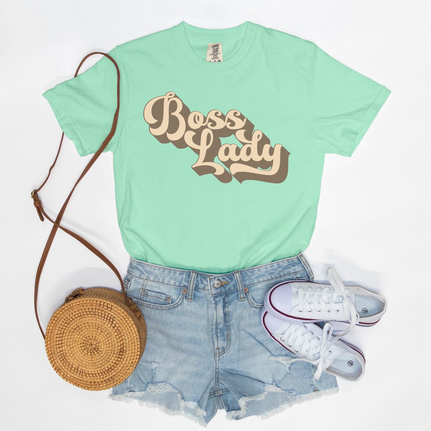 Embrace vintage vibes with the Comfort Color Tee 1717 - Boss Lady Retro from Designs On The Go. This comfy, durable tee boasts a chic, nostalgic design perfect for making a statement. Whether you’re at work or out with friends, this tee combines style and comfort seamlessly.