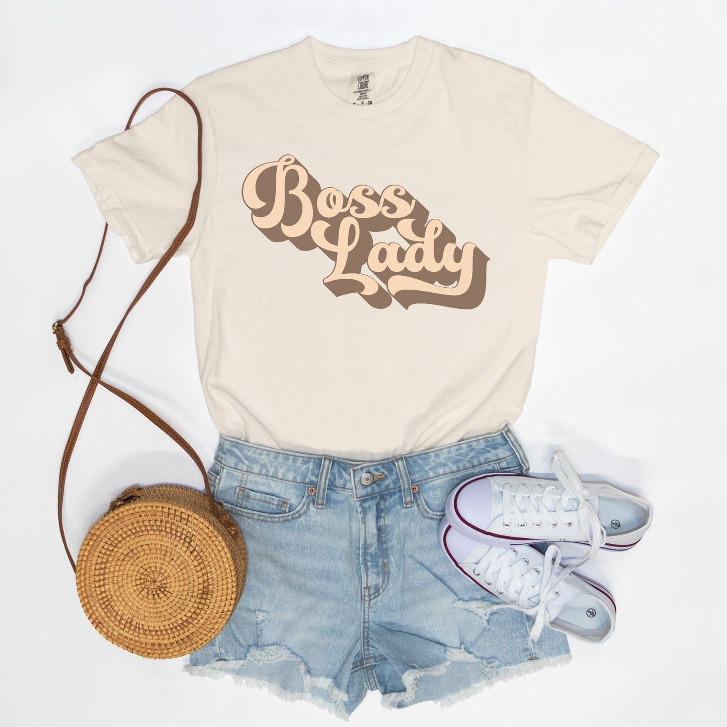 Embrace vintage vibes with the Comfort Color Tee 1717 - Boss Lady Retro from Designs On The Go. This comfy, durable tee boasts a chic, nostalgic design perfect for making a statement. Whether you’re at work or out with friends, this tee combines style and comfort seamlessly.